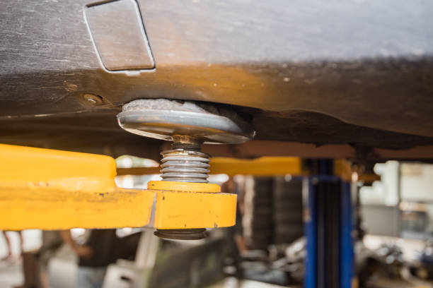 What is an automotive bushing, and what does it do?